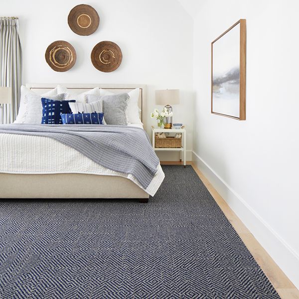 Blue patterned carpet in bedroom
