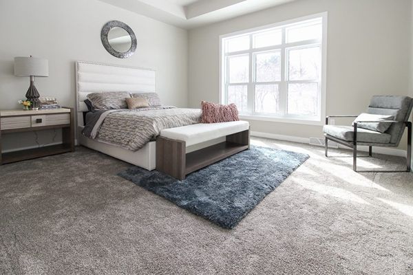 Bright bedroom with gray carpet