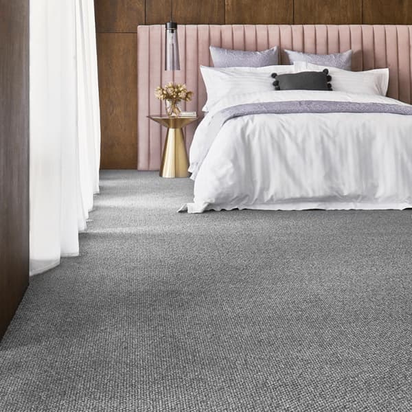 Gray carpet in modern bedroom