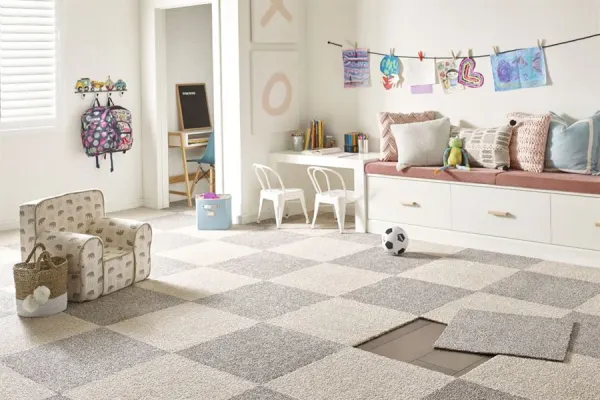 Gray patterned carpet tiles playroom