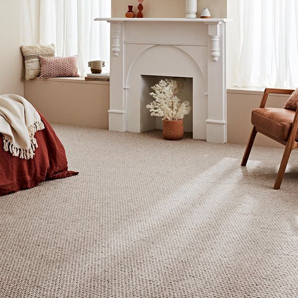Beige carpet flooring in warm modern bedroom
