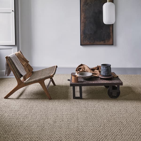 Beige wool carpet in elegant living room with neutral furniture