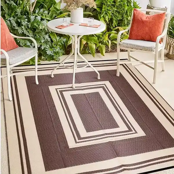 Brown geometric outdoor rug on patio