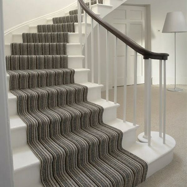 Grey stair carpet runner with glass staircase railing