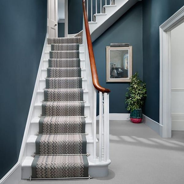 Modern grey stair carpet runner installed on staircase