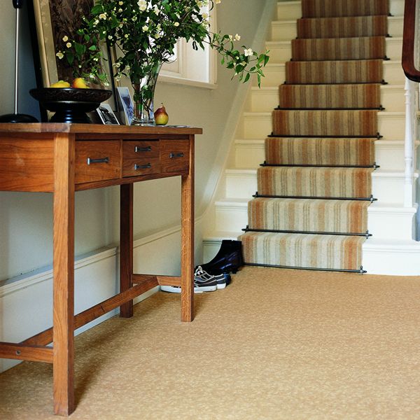 Staircase with patterned carpet runner in modern home