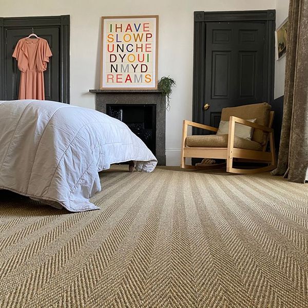 Textured sisal carpet in cozy bedroom