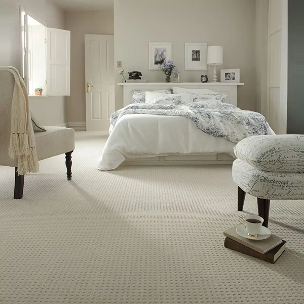 Elegant bedroom with wall to wall carpet
